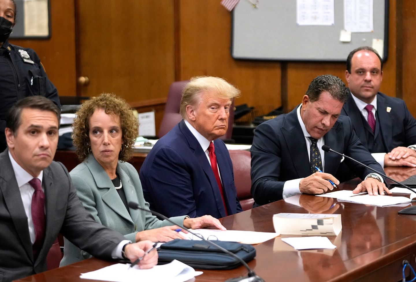 U.S. President Donald Trump sits with his attorneys
