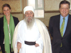 Erin Houlihan '11,  left, in Iraq with Osama Al-Nujaifi, the speaker of the Iraqi  Parliament, and William Spencer, right.